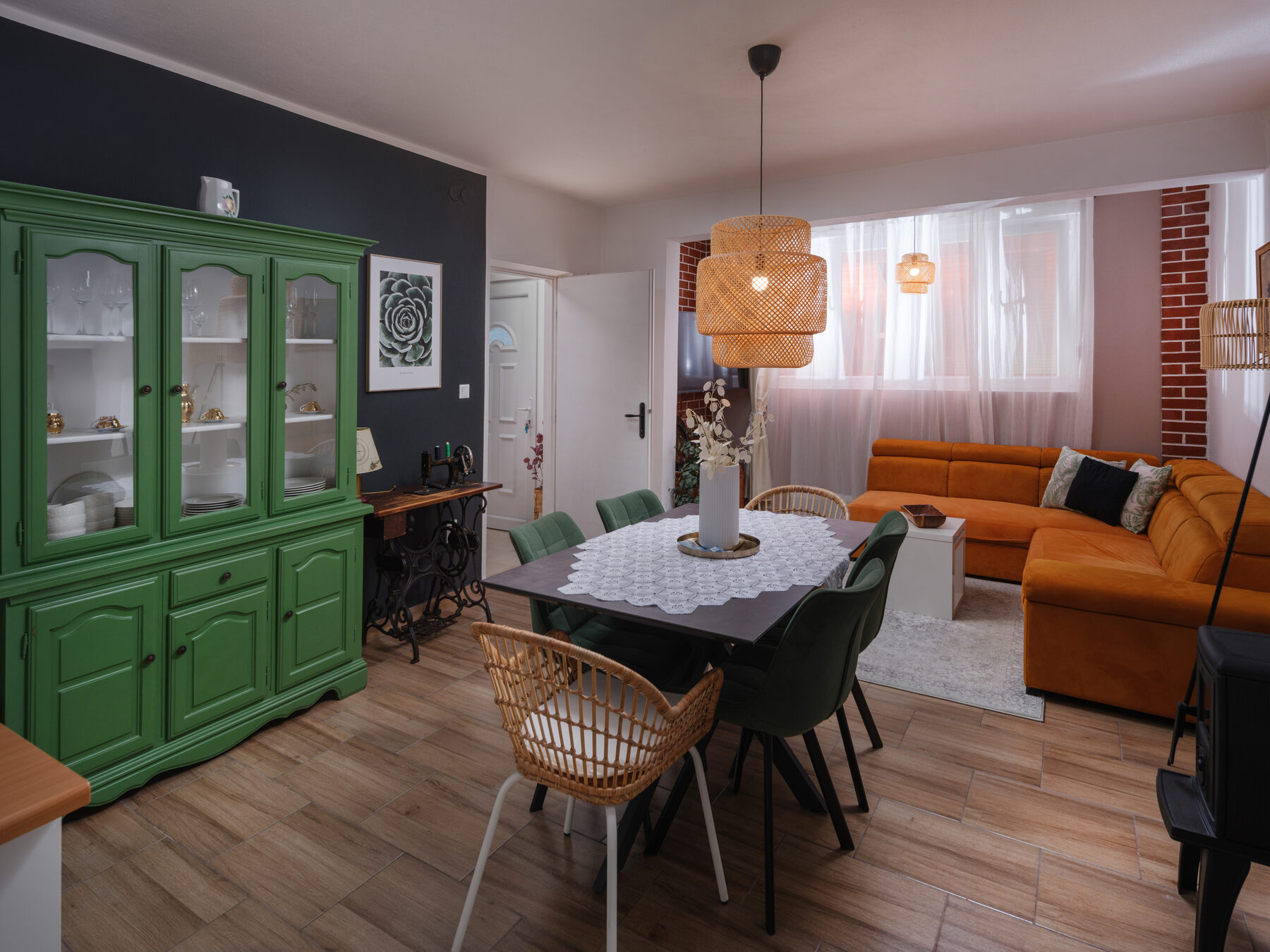 Living room with green hutch and orange sofa